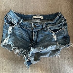 Cut off Jean shorts with holes.